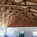 Structural timber trusses for ceiling.