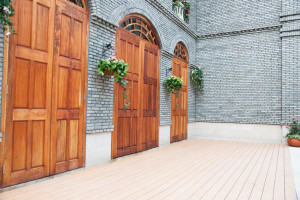 Traditional Chinese house with wooden arch doors and deck