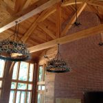 Living room trusses with hanging chandeliers.