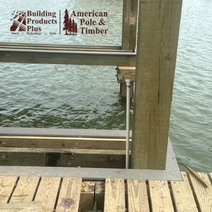 EcoPile and treated wood pilings at a Gulf Coast dock construction site in Texas
