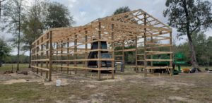 framing-lumber-and-square-timber-pilings-for-barn