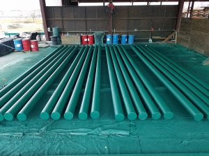 10in x 30ft Poly coated gun barrel piling