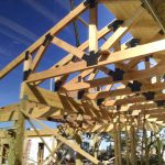 Timber trusses for building exterior in Lender, Tx.