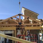 Far view of timber trusses for building exterior in Lender, Tx.